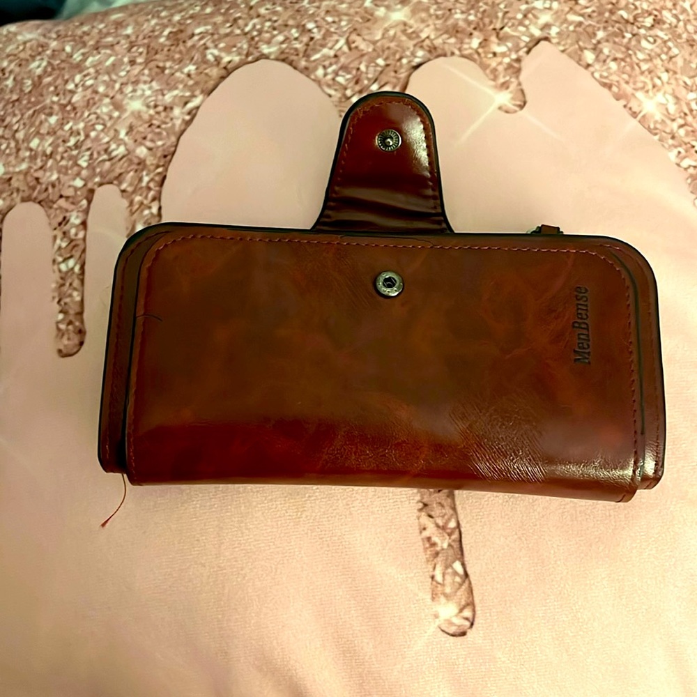 Solid Menbense burgundy leather men or woman’s wallet.